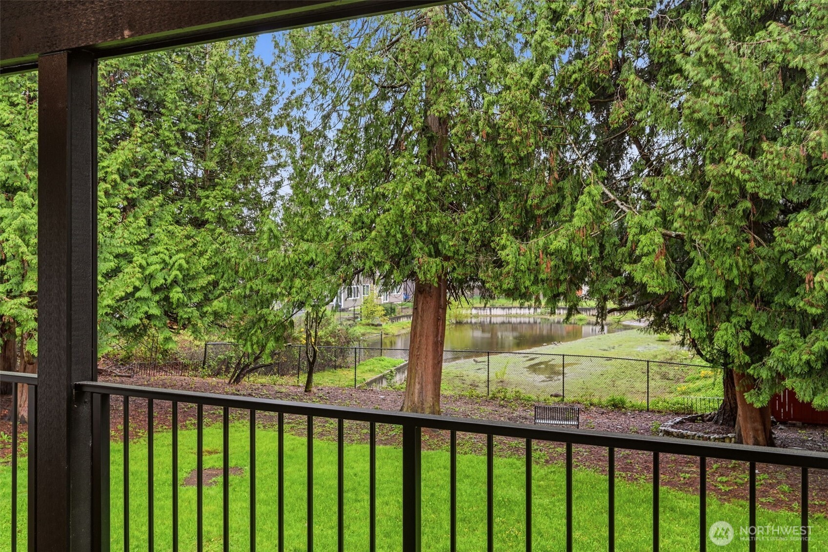 Tranquil view of pond behind the property. Pond makes it unlikely you'll have neighbors built behind you!