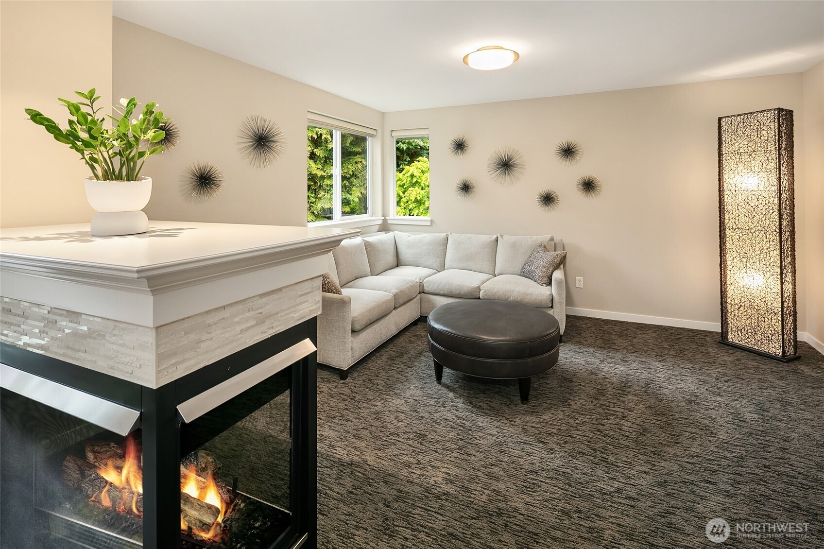 Relaxing gas fireplace nestled next to the sitting area in the Primary Suite.