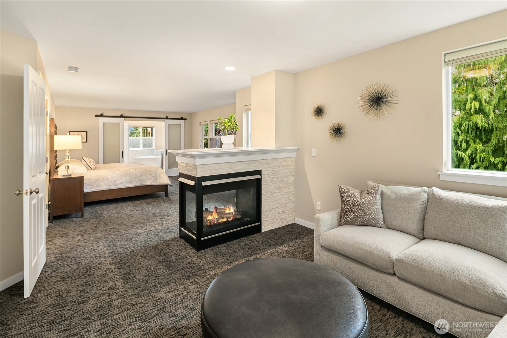 Sitting area next to gas fireplace in Primary Suite.