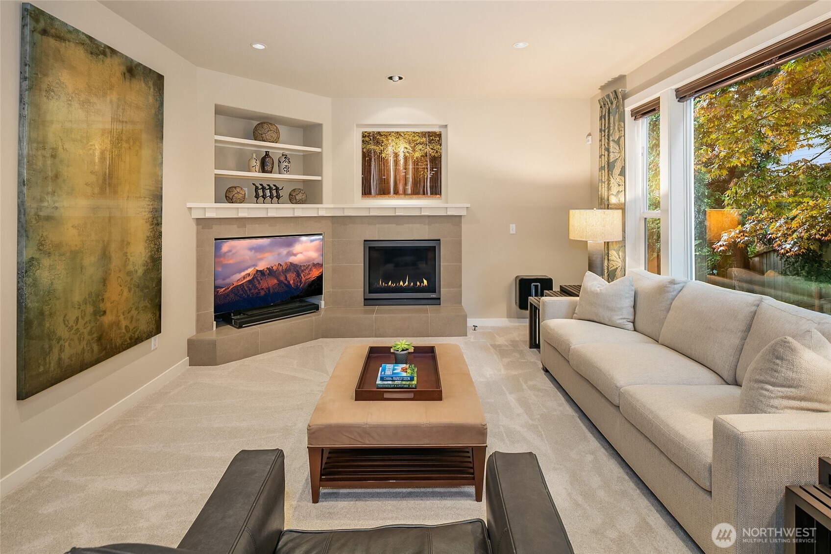 Flow effortlessly into the inviting family room, anchored by a sleek gas fireplace.