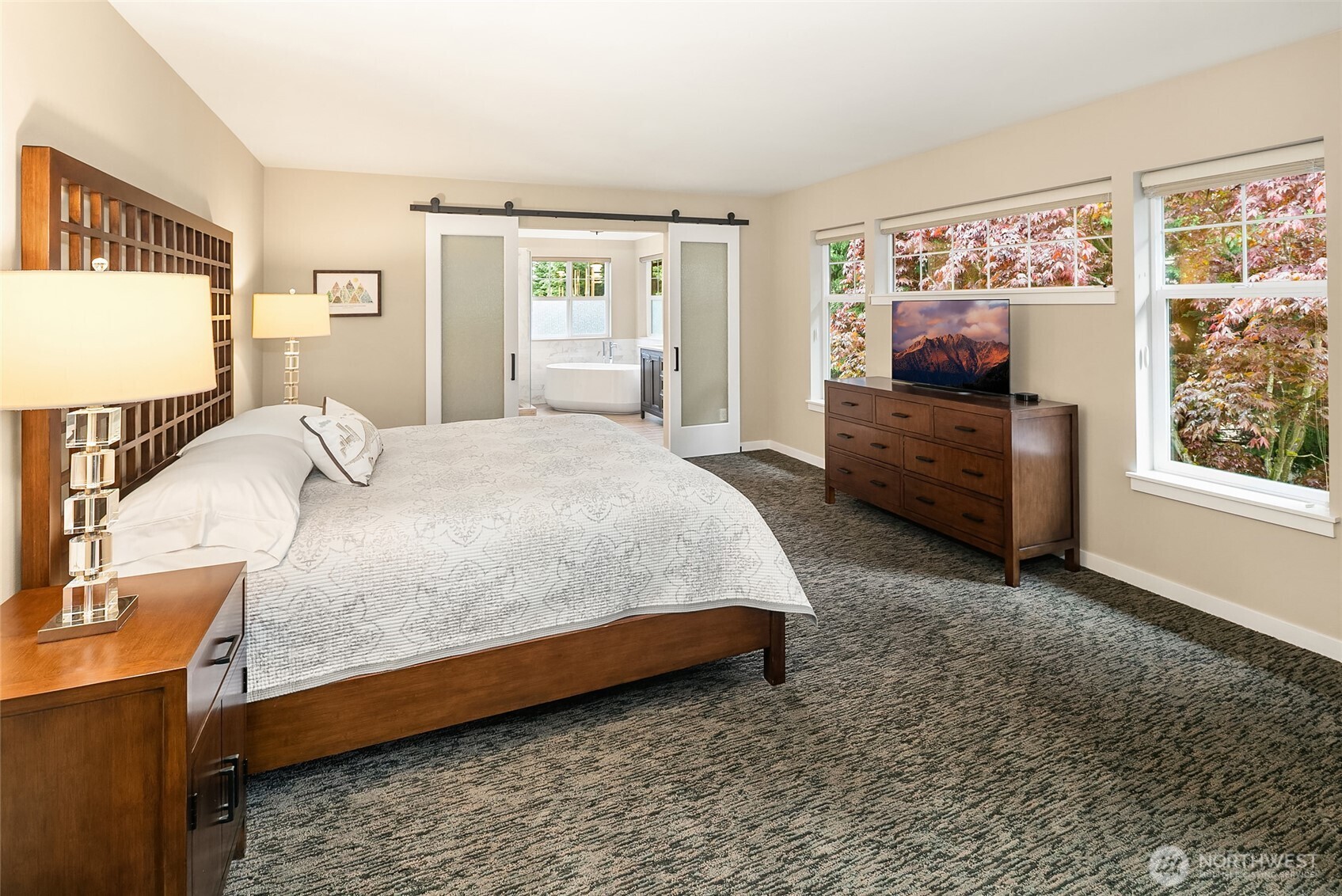 Magnificent Primary Suite has sitting room with gas fireplace and private updated bath with heated floors.