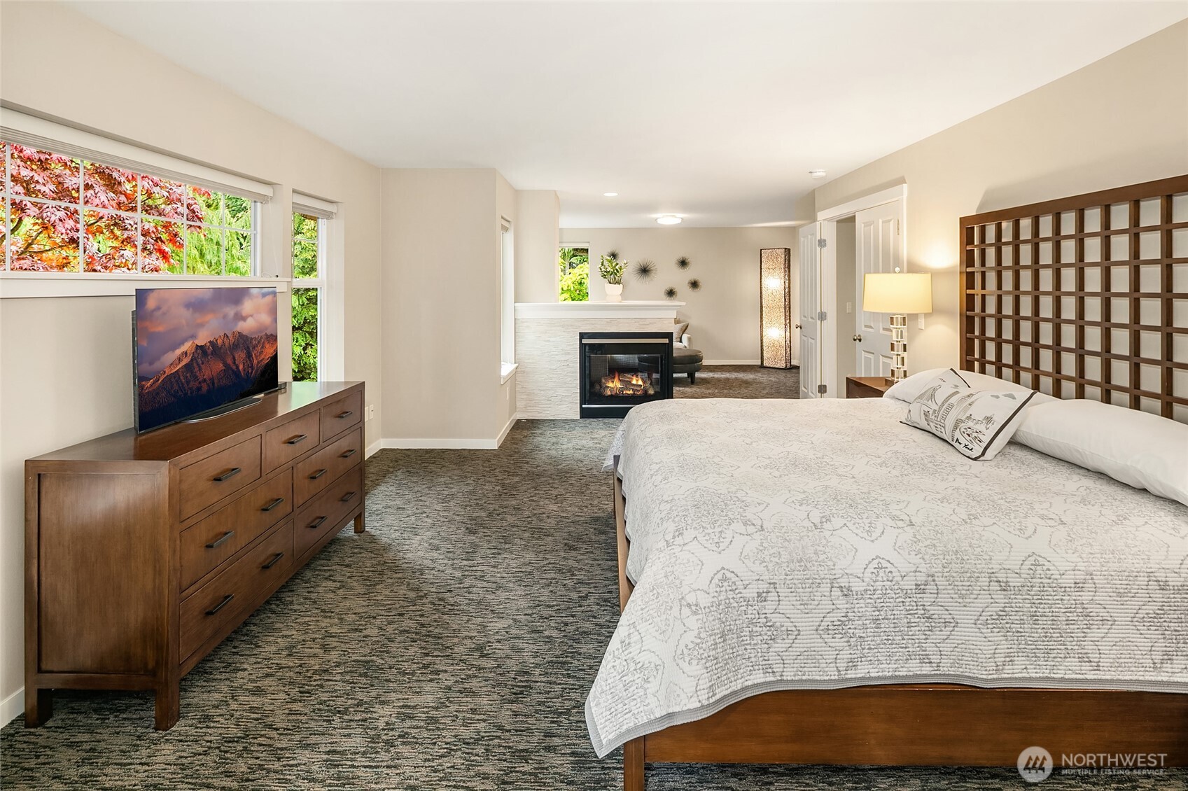 Magnificent Primary Suite has sitting room with gas fireplace and private updated bath with heated floors.