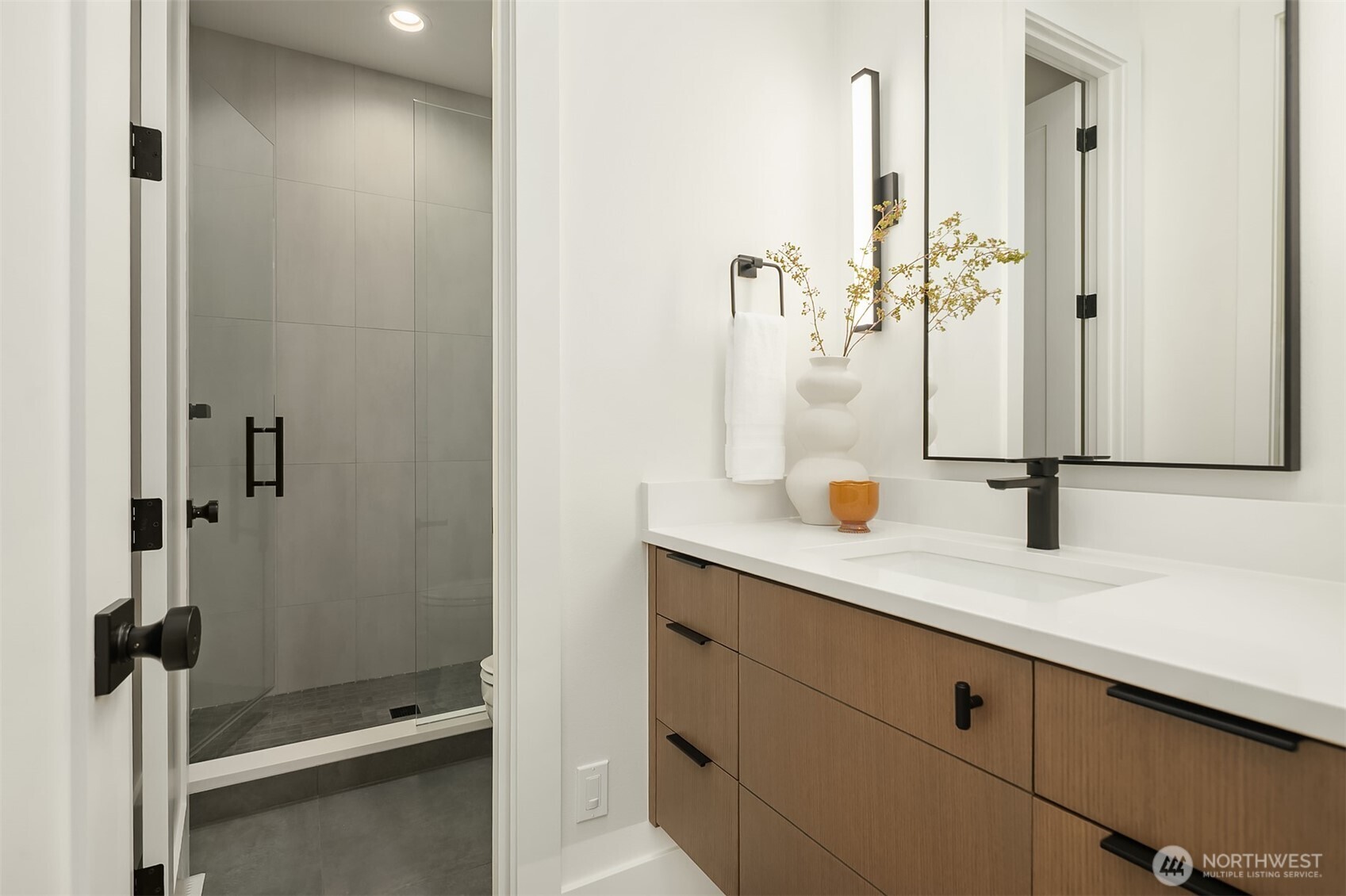 Spacious bonus room with wet bar and a private door for sound control — perfect for movie nights, game days, and late-night entertaining.