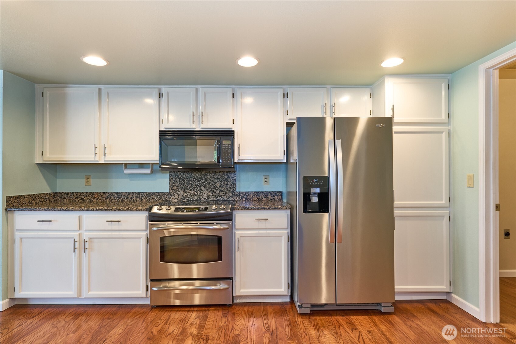 Additional view of the kitchen.