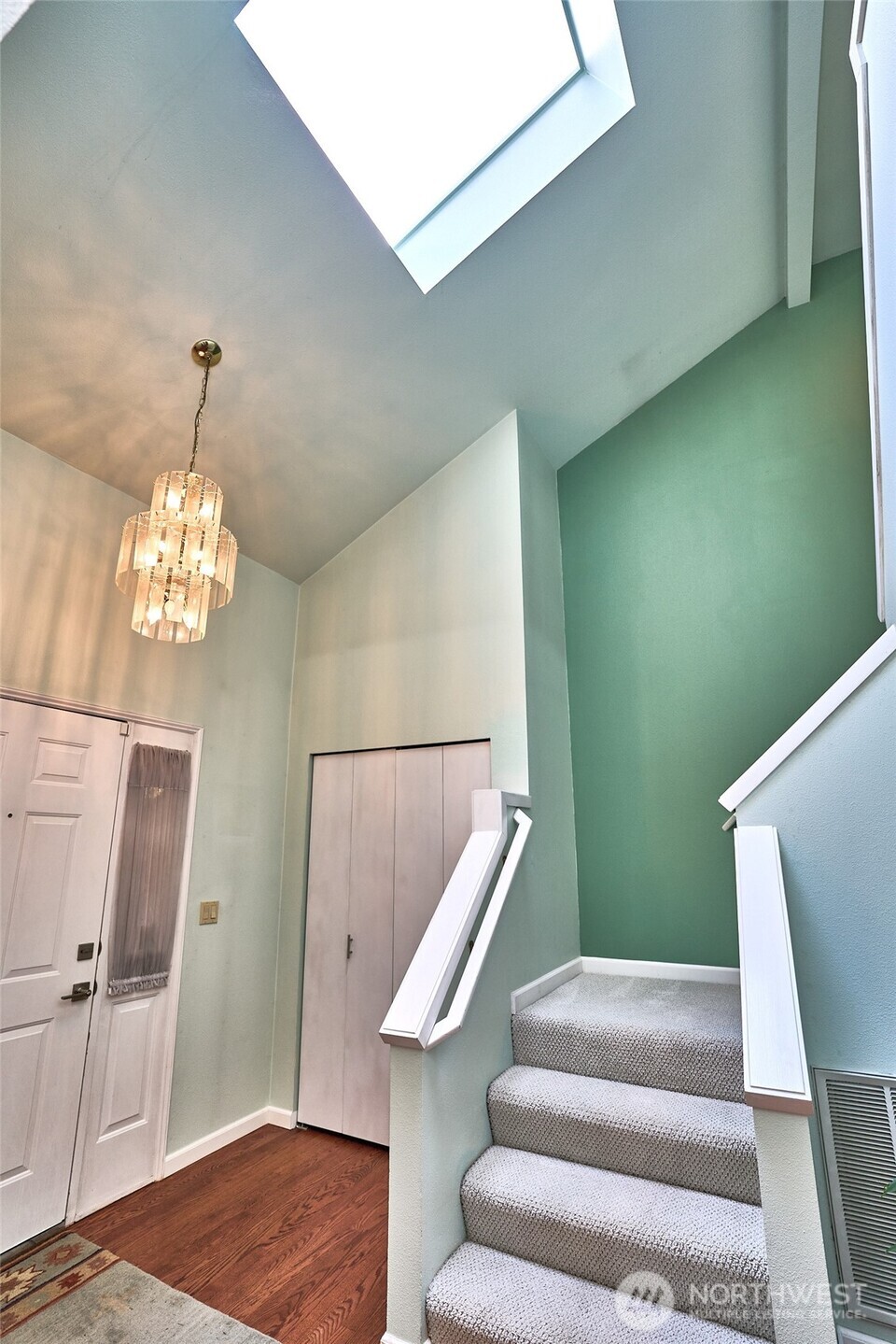 The high vaulted entry with large skylight emphasizes natural light and openness.