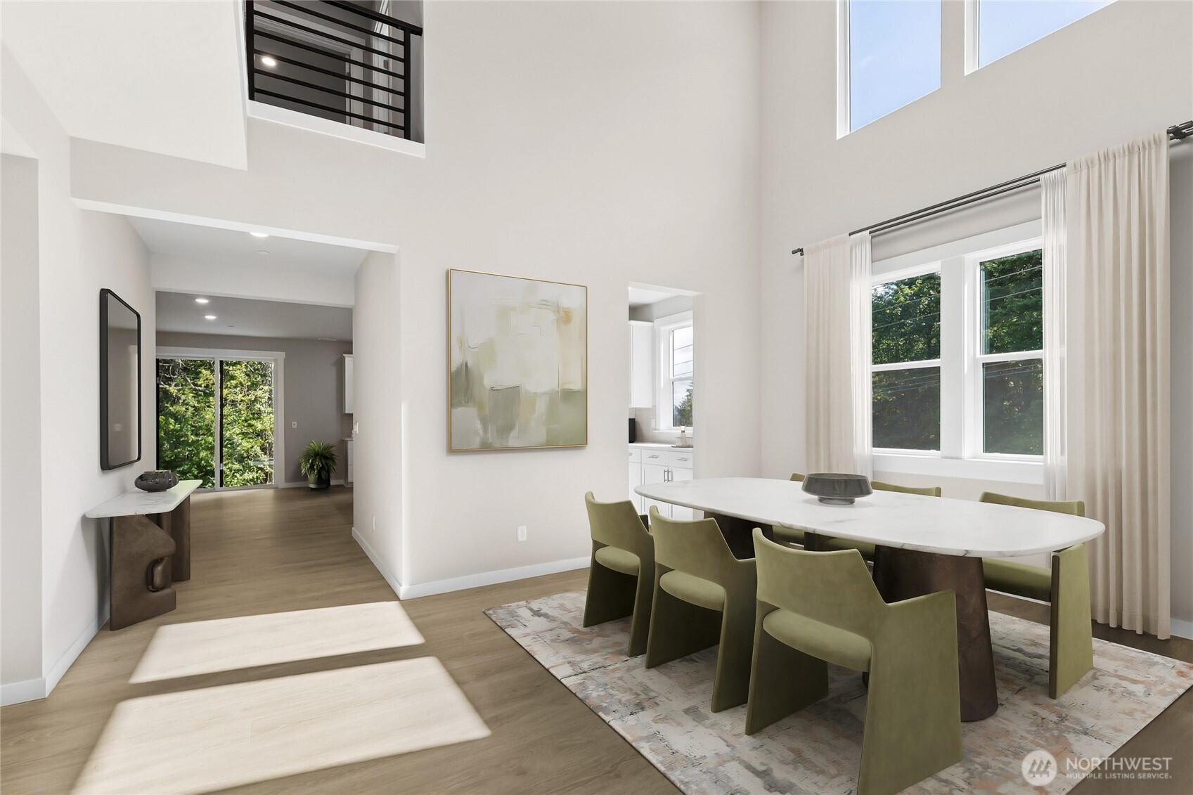Entry to 2 story formal dining room with walls of windows - virtually staged.