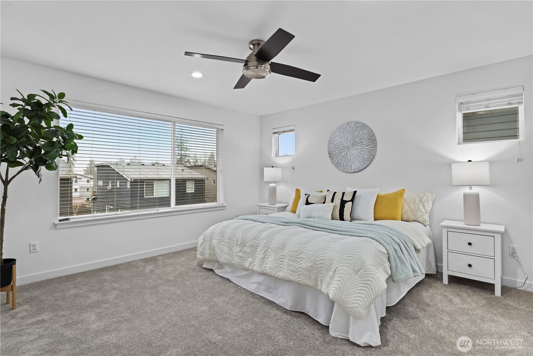 Large Primary bedroom with so much natural light. The spacious room offers a tranquil escape, flooded with sunlight throughout the day.
