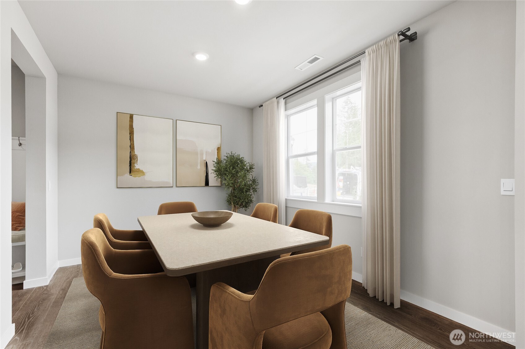 Formal dining area off main entrance. Virtual staging for representation purposes.