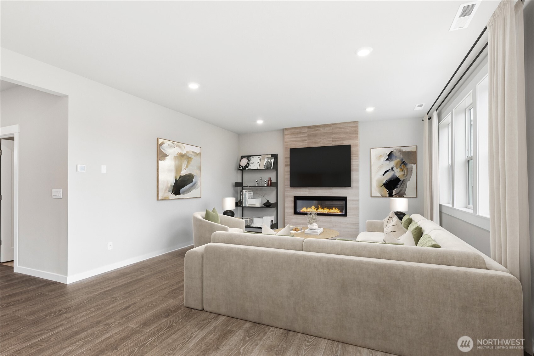 9'ceilings in living area.  Electric fireplace and tiled feature wall.  Virtual staging