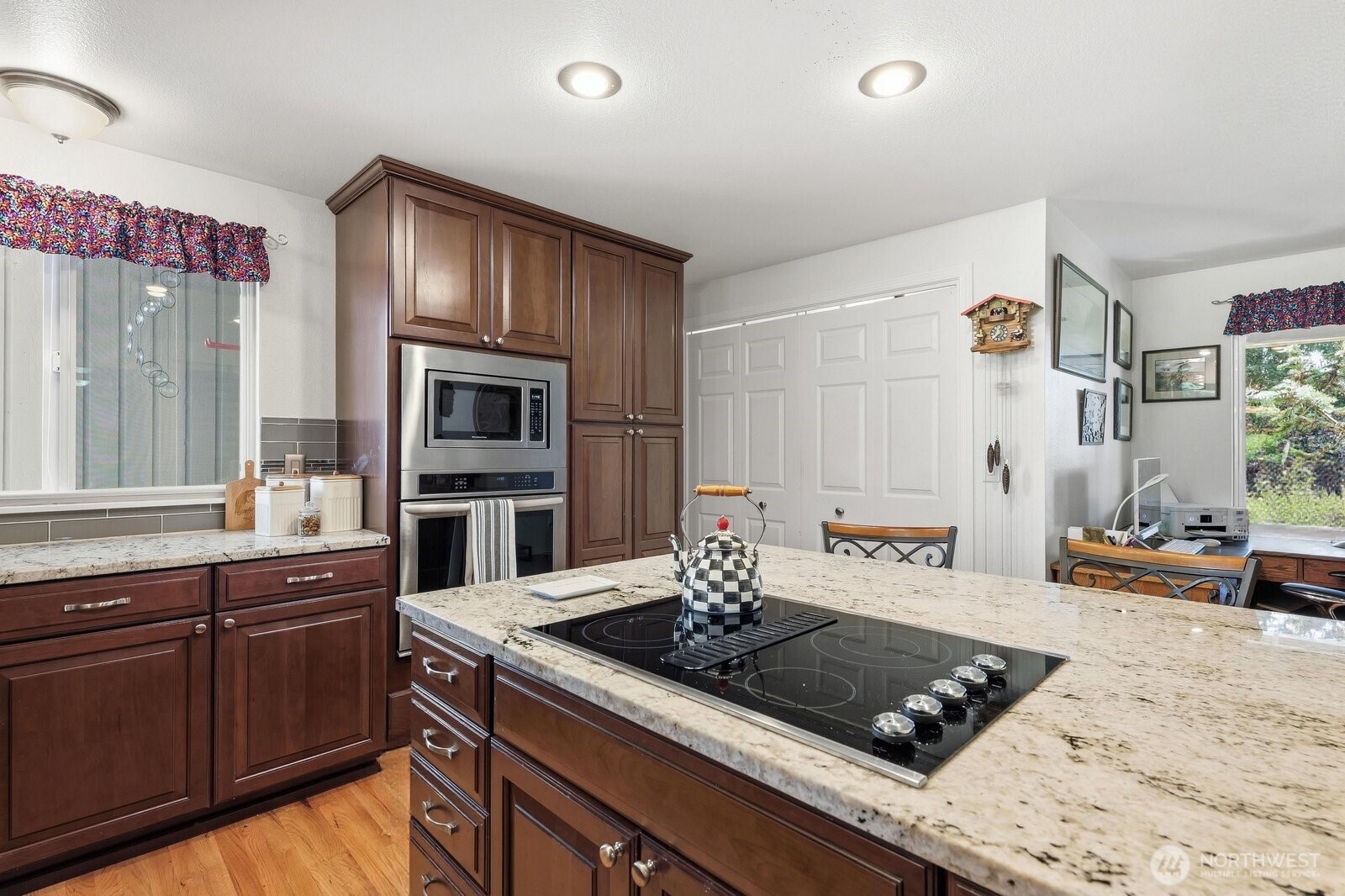 A closer look at the premium slab granite countertops and meticulous custom woodwork.