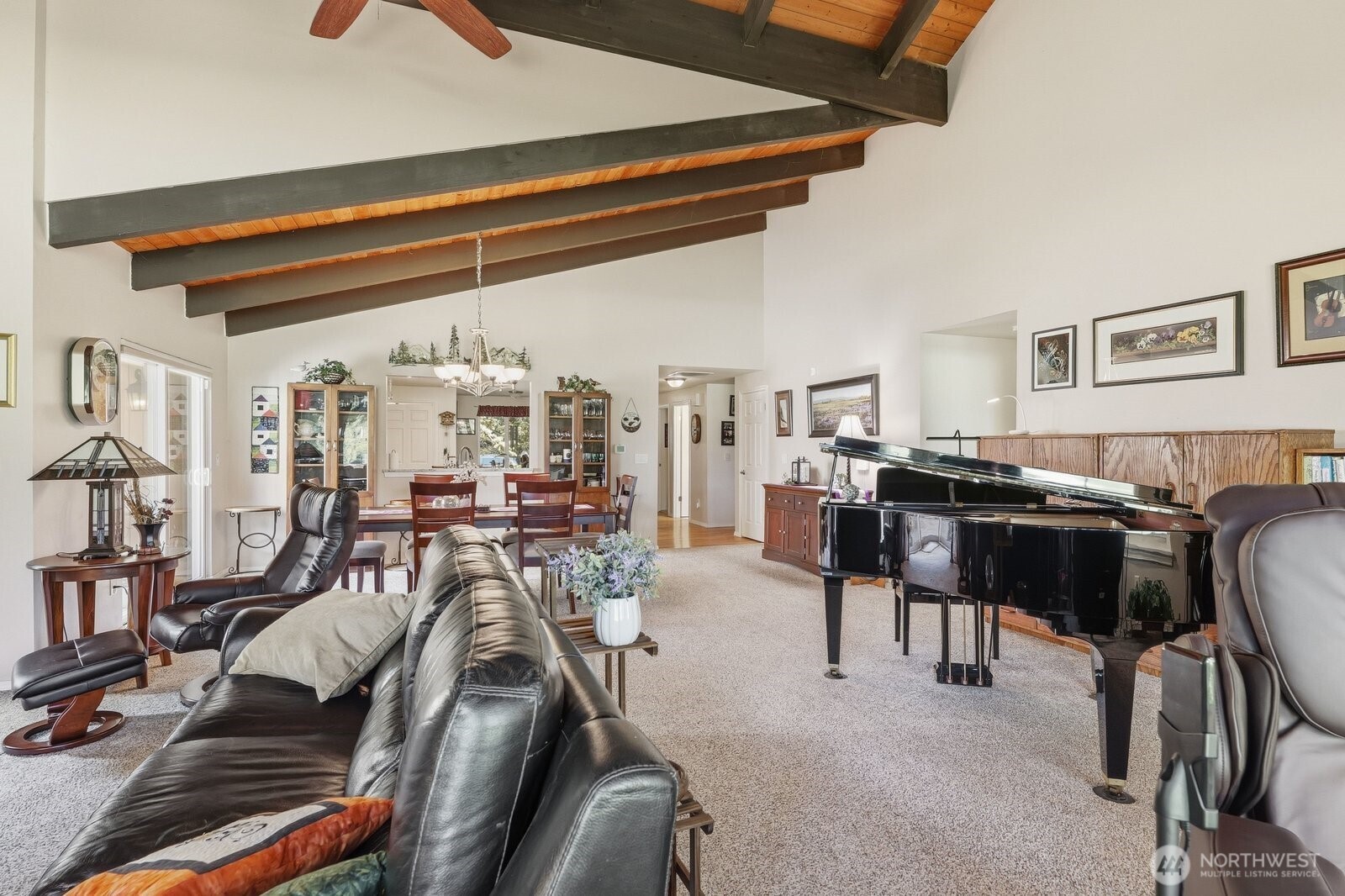 Large enough to comfortably host a grand piano, full dining set, and generous media seating.