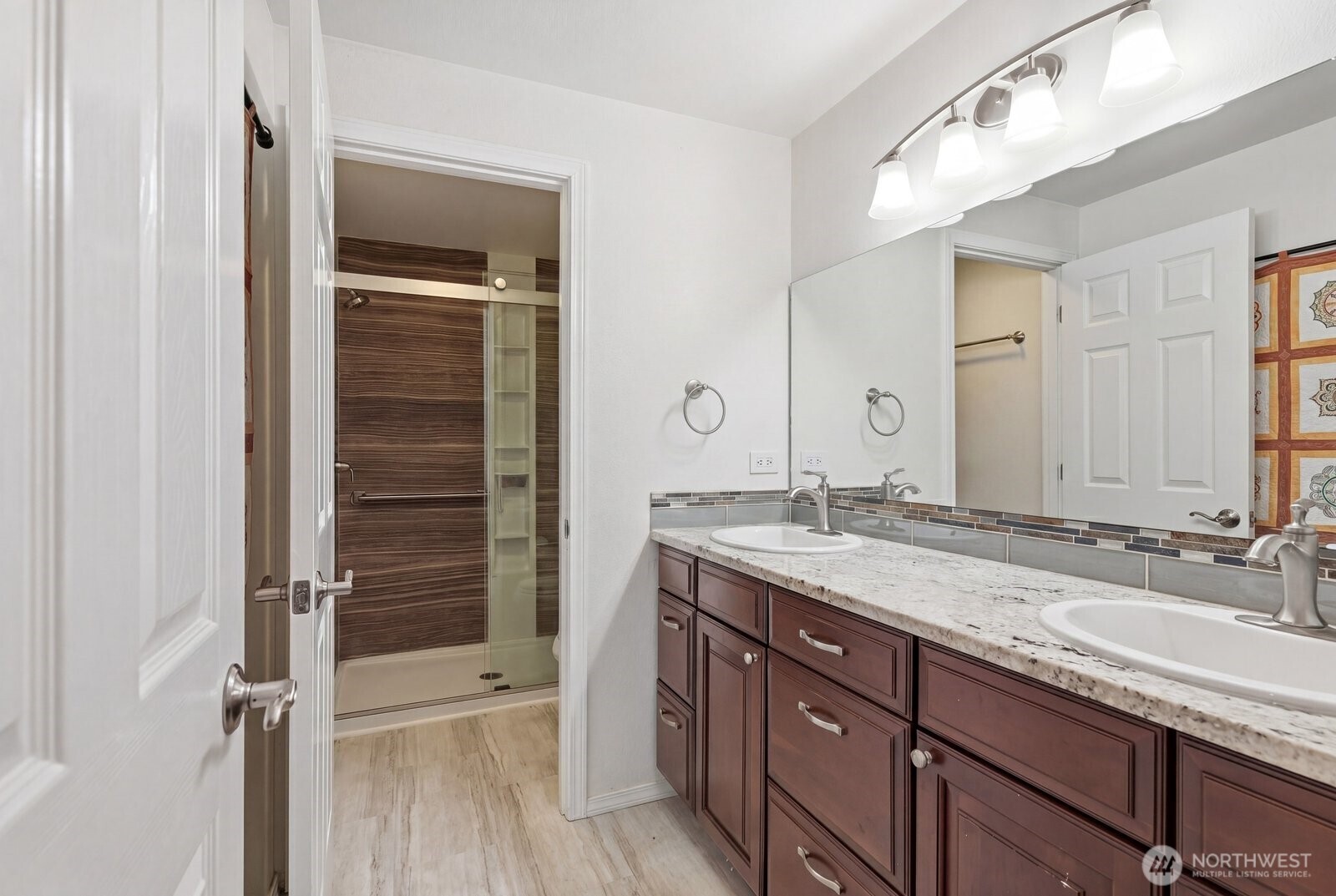 The primary ensuite is tastefully finished with custom slab granite and modern fixtures.