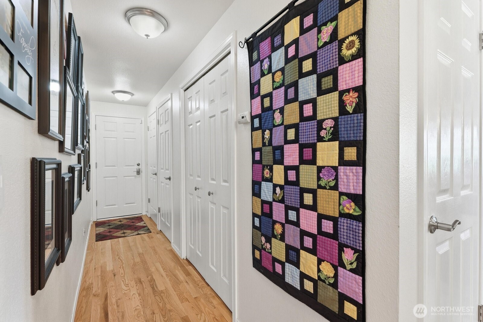The hallway leading to the garage is lined with deep closets, ensuring a place for everthing.