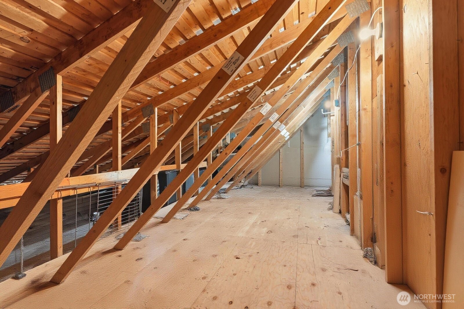 A pull-down ladder provides easy access to a massive attic for all your seasonal storage needs.