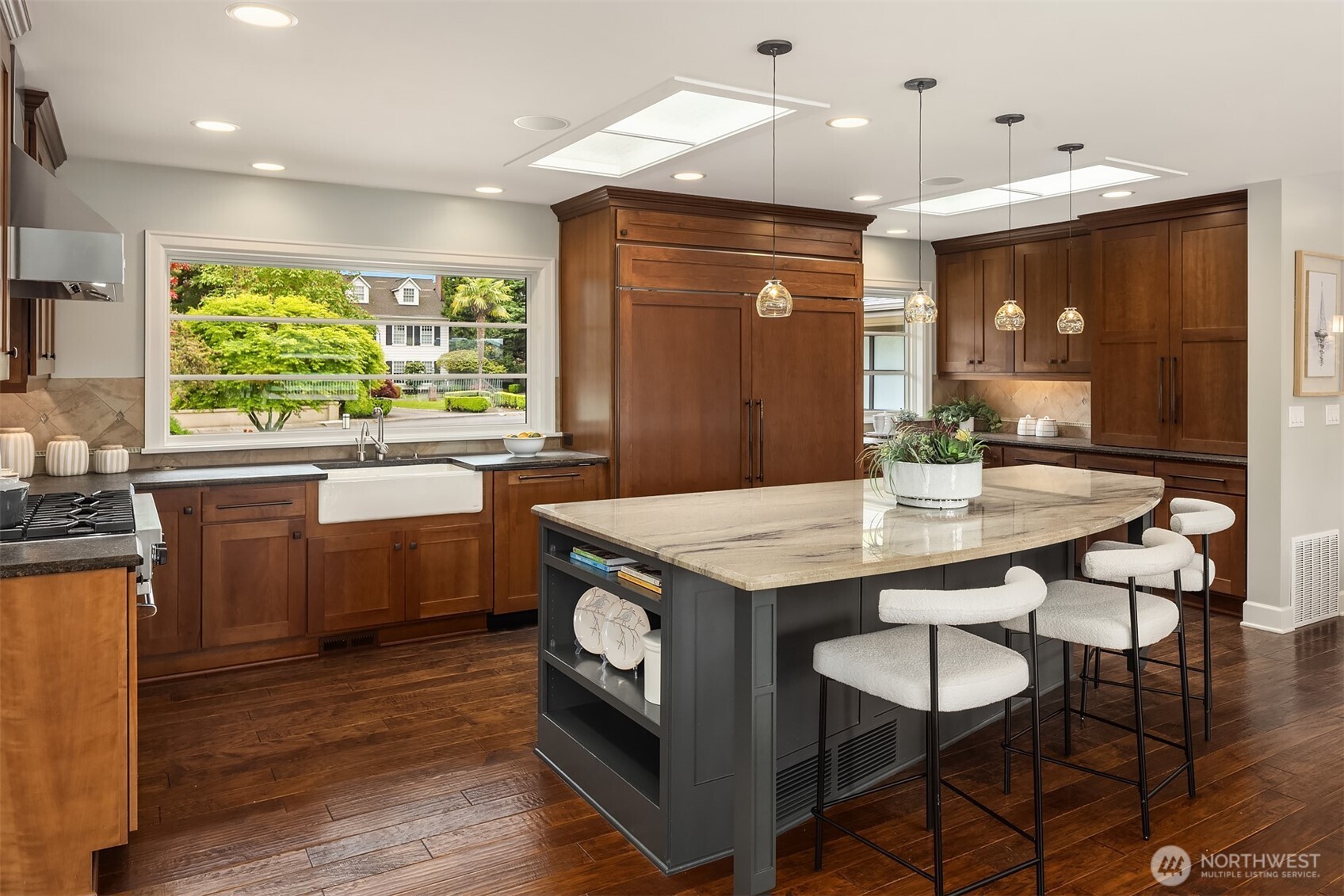 The heart of the home—where morning light filters through skylights, coffee is poured at the island, and everyday moments gather with ease.