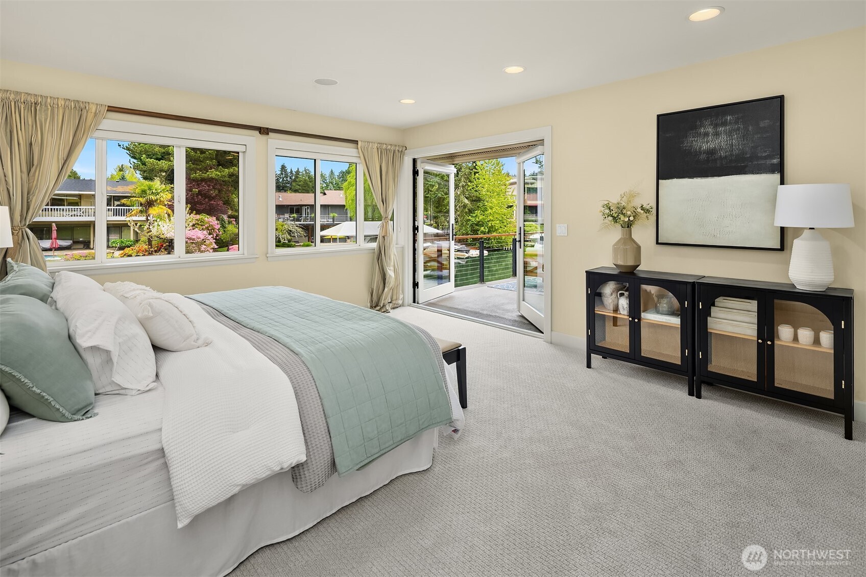 Wake to the stillness of the canal and step outside—this is a primary suite designed around light, air, and effortless indoor-outdoor living.