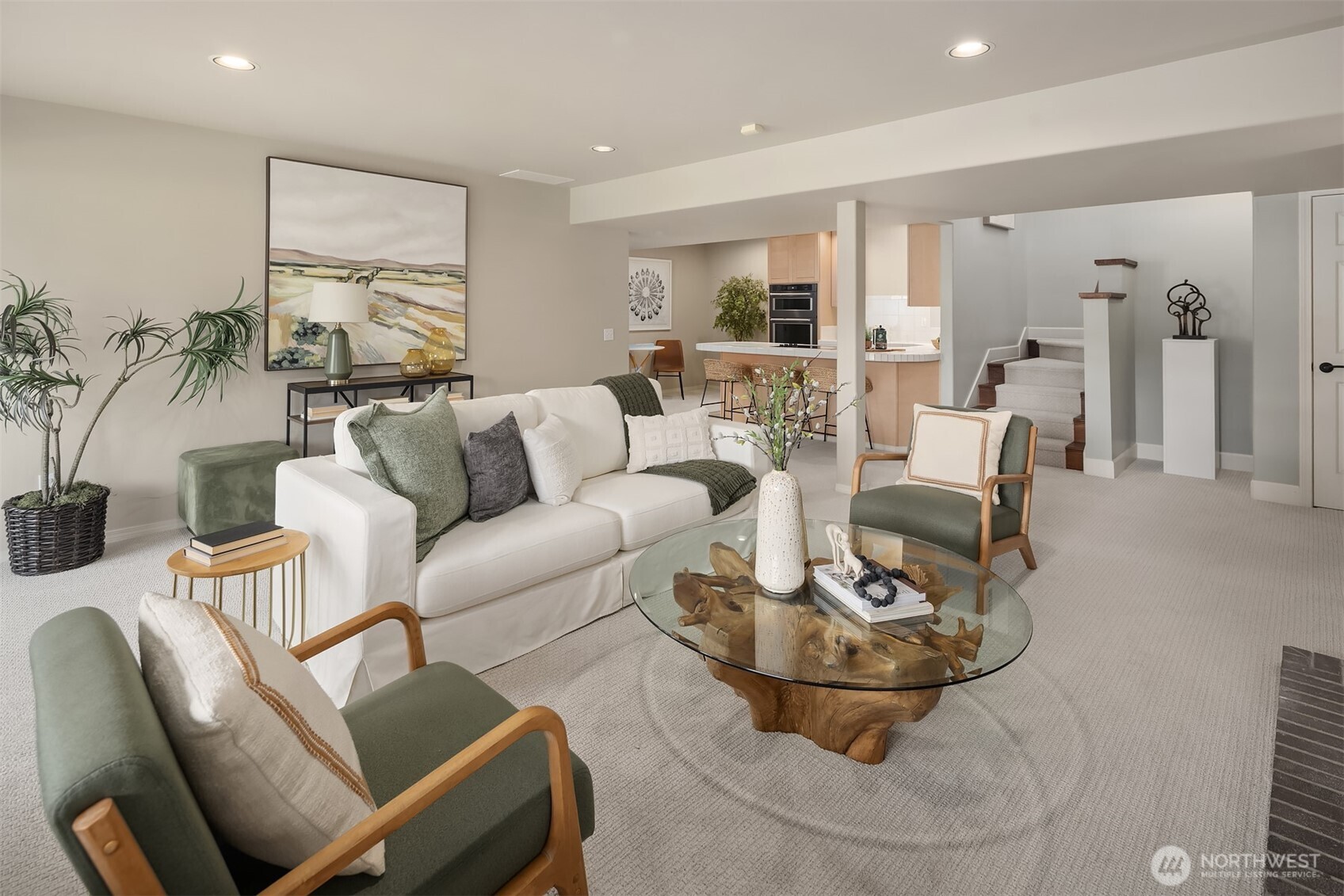 An expansive rec room that flows seamlessly into the secondary kitchen—perfect for hosting, game nights, or relaxed weekends at home.