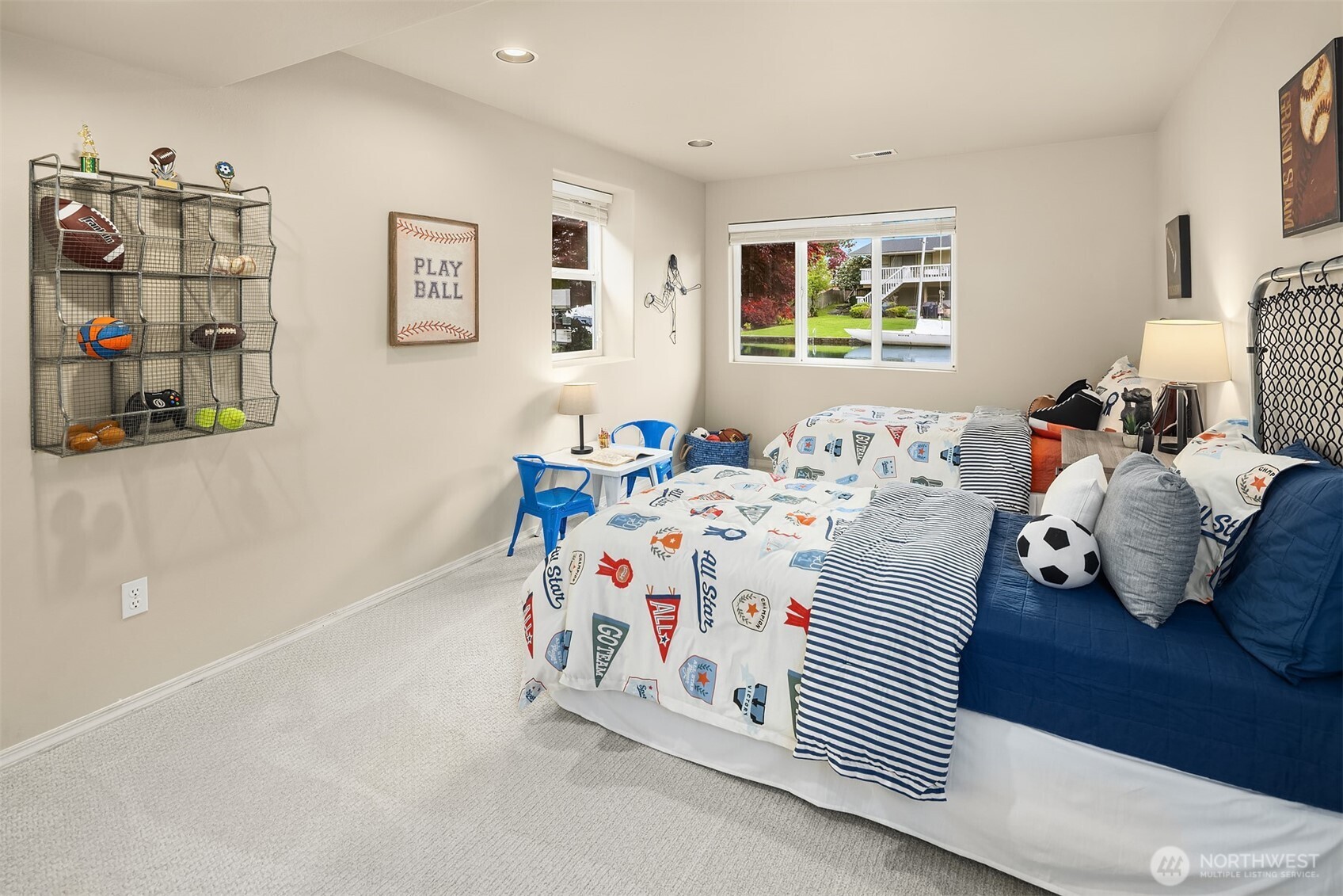 A bright and inviting bedroom with soft natural light and tranquil views—ideal for guests or everyday living.