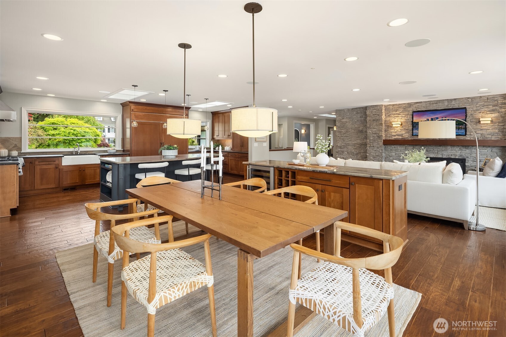 Wine chilled, friends gathered, boats returning at dusk—custom built-ins with a GE Monogram beverage fridge create a natural hub for entertaining that flows seamlessly from indoors to the water’s edge.