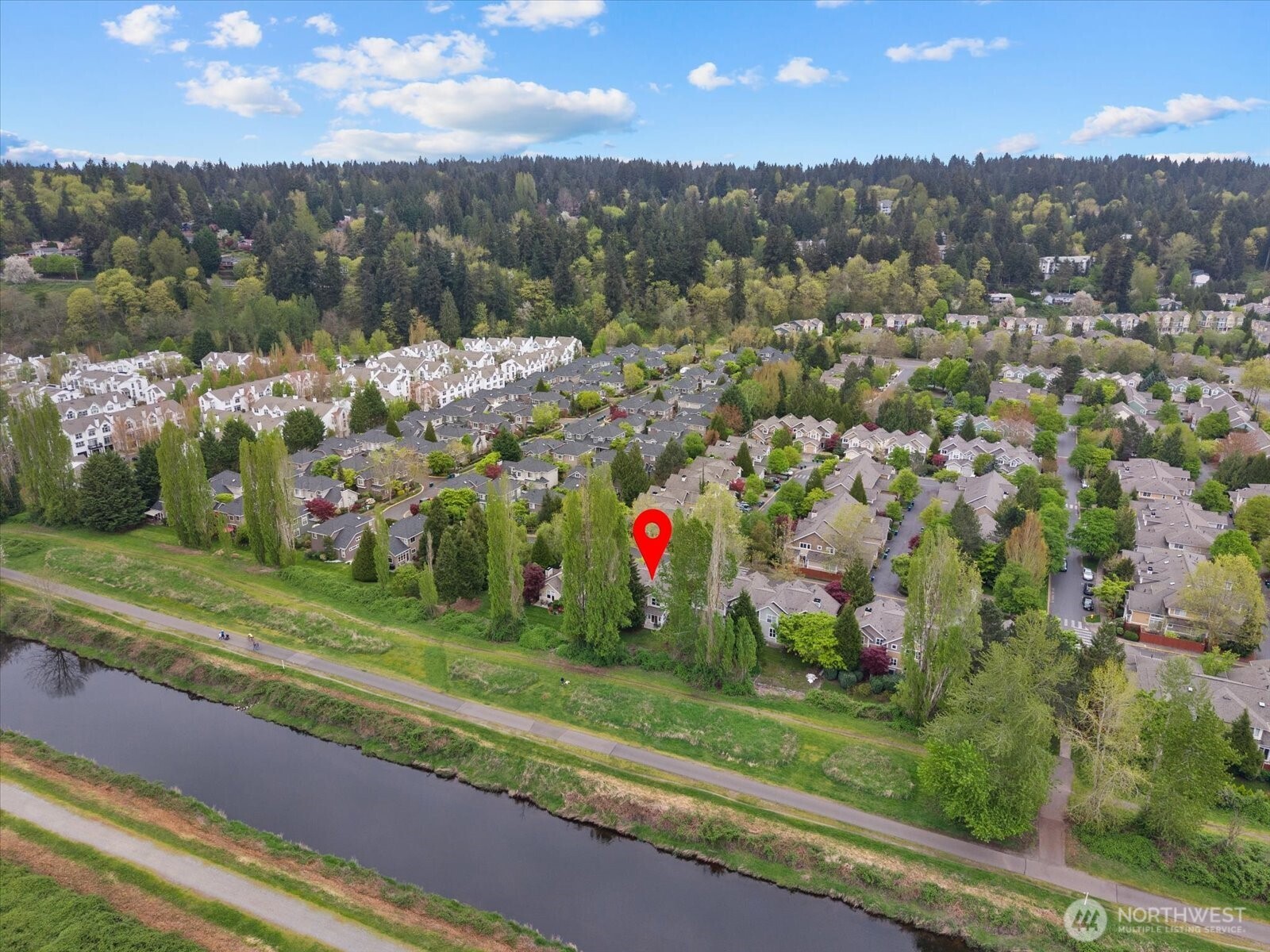 This property sits on a premium lot adjacent to the scenic Sammamish River Trail.