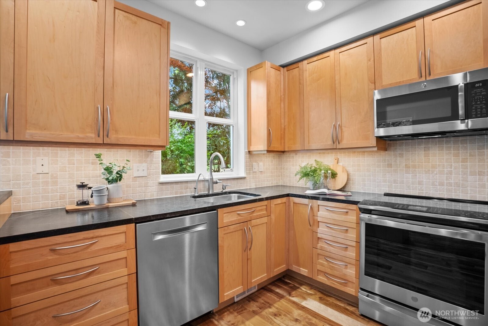 Updated kitchen with KitchenCraft cabinets and soapstone counters