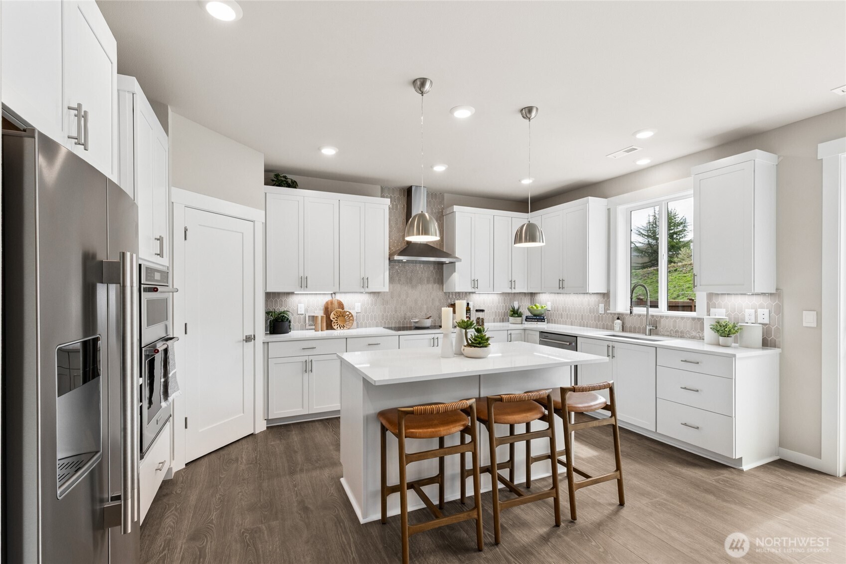 Tiled electric fireplace is the focus of the open plan living areas. Accent wall not included.