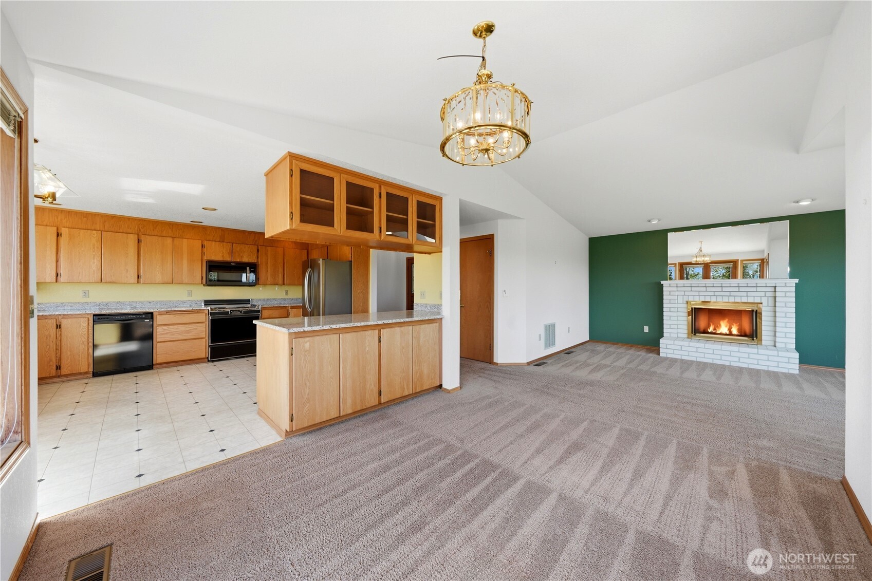 Looking back for a view of the kitchen, dining room and living room.