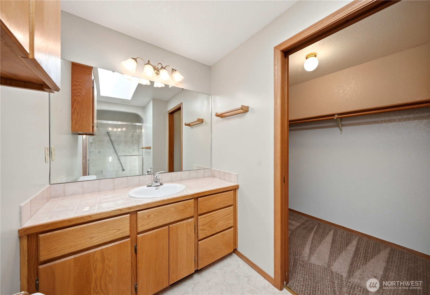 Primary bathroom with walk-in closet.