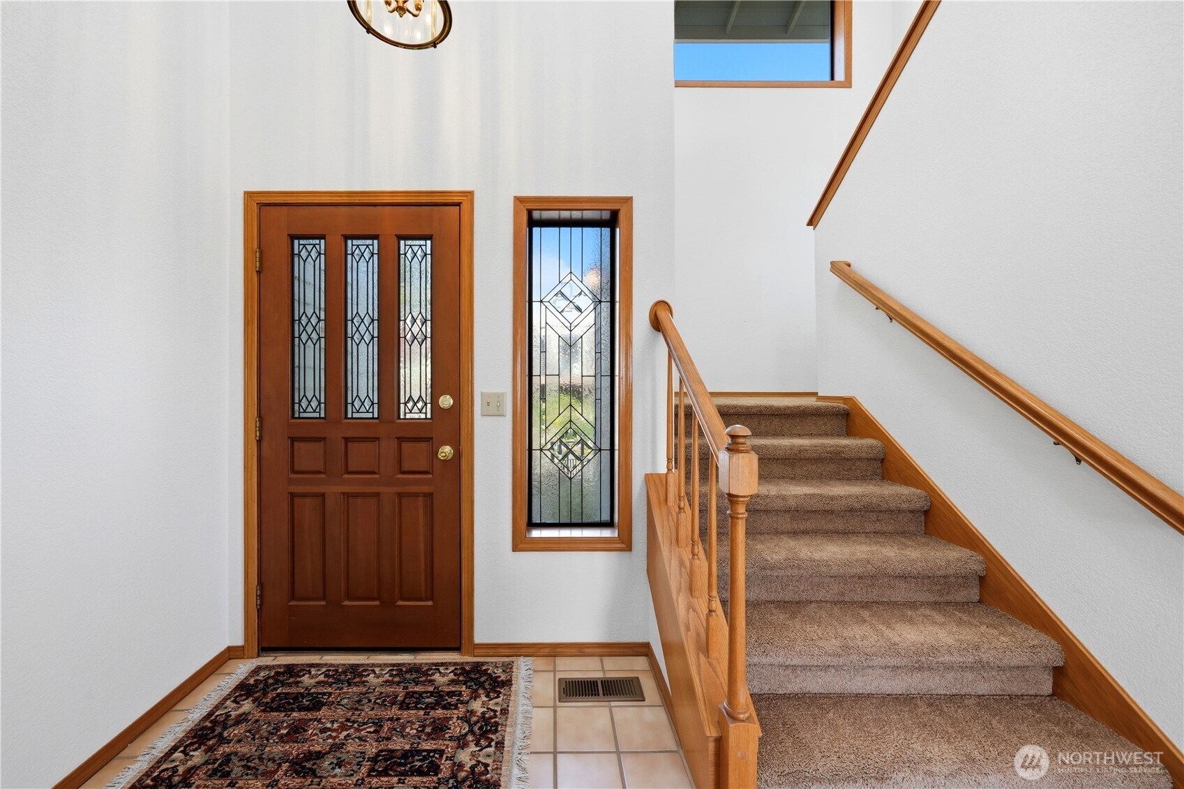 Stairway heading up to the second floor from the main entry.