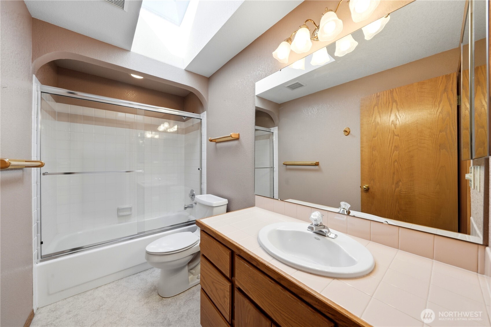 Second floor full bathroom with skylight!