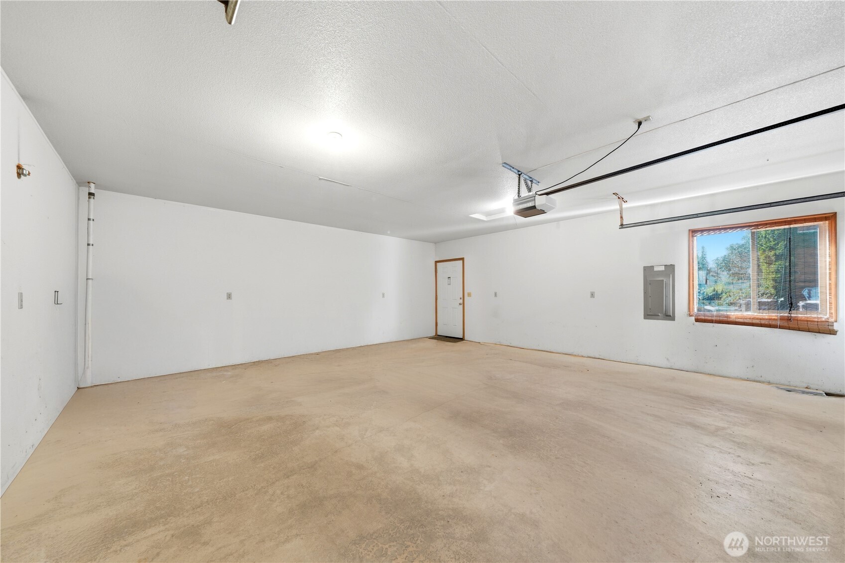 Big garage with double door garage remote opener.