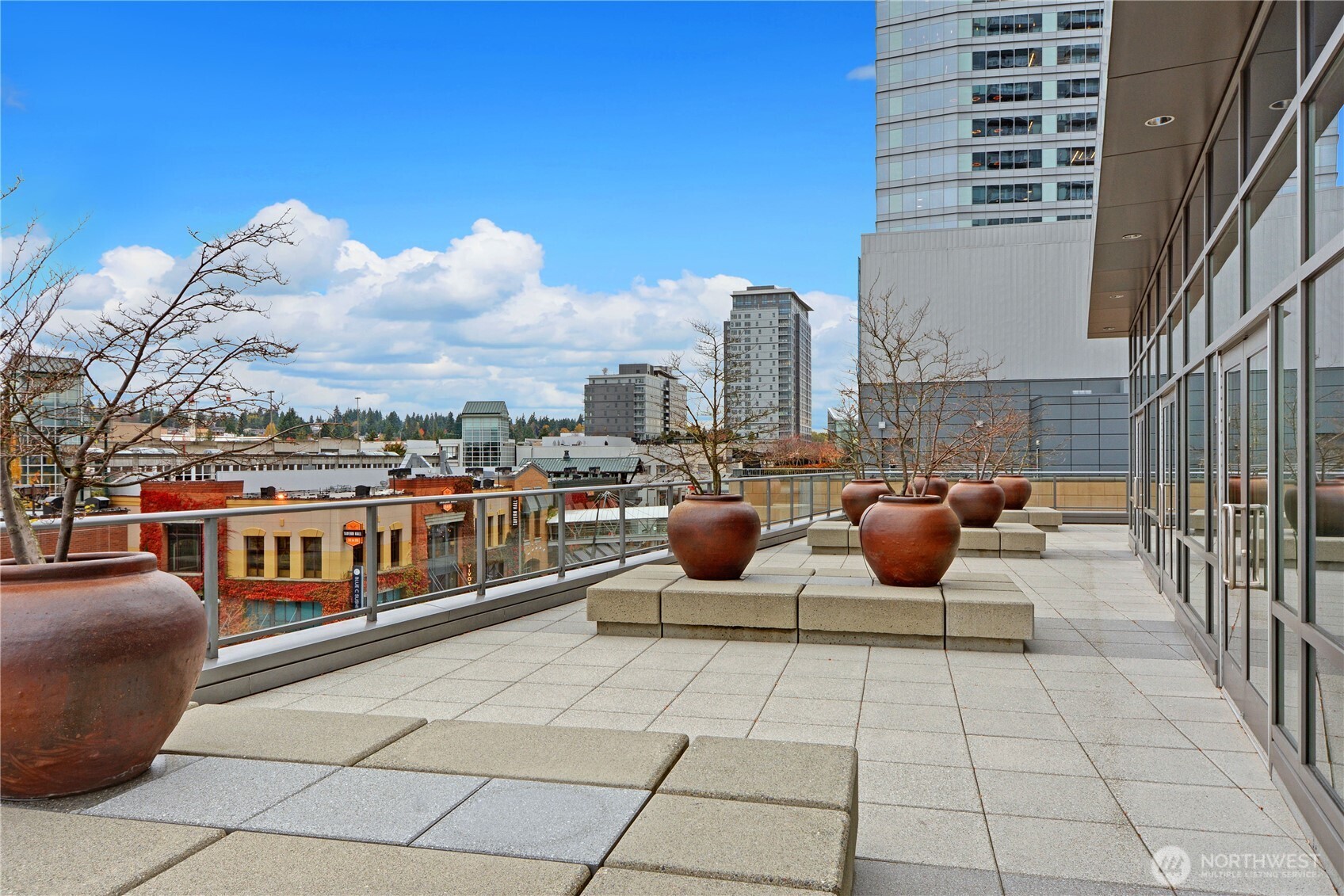 The west facing outdoor deck located off the swimming pool and hot tub gets plenty of sun and overlooks The Bellevue Collection.