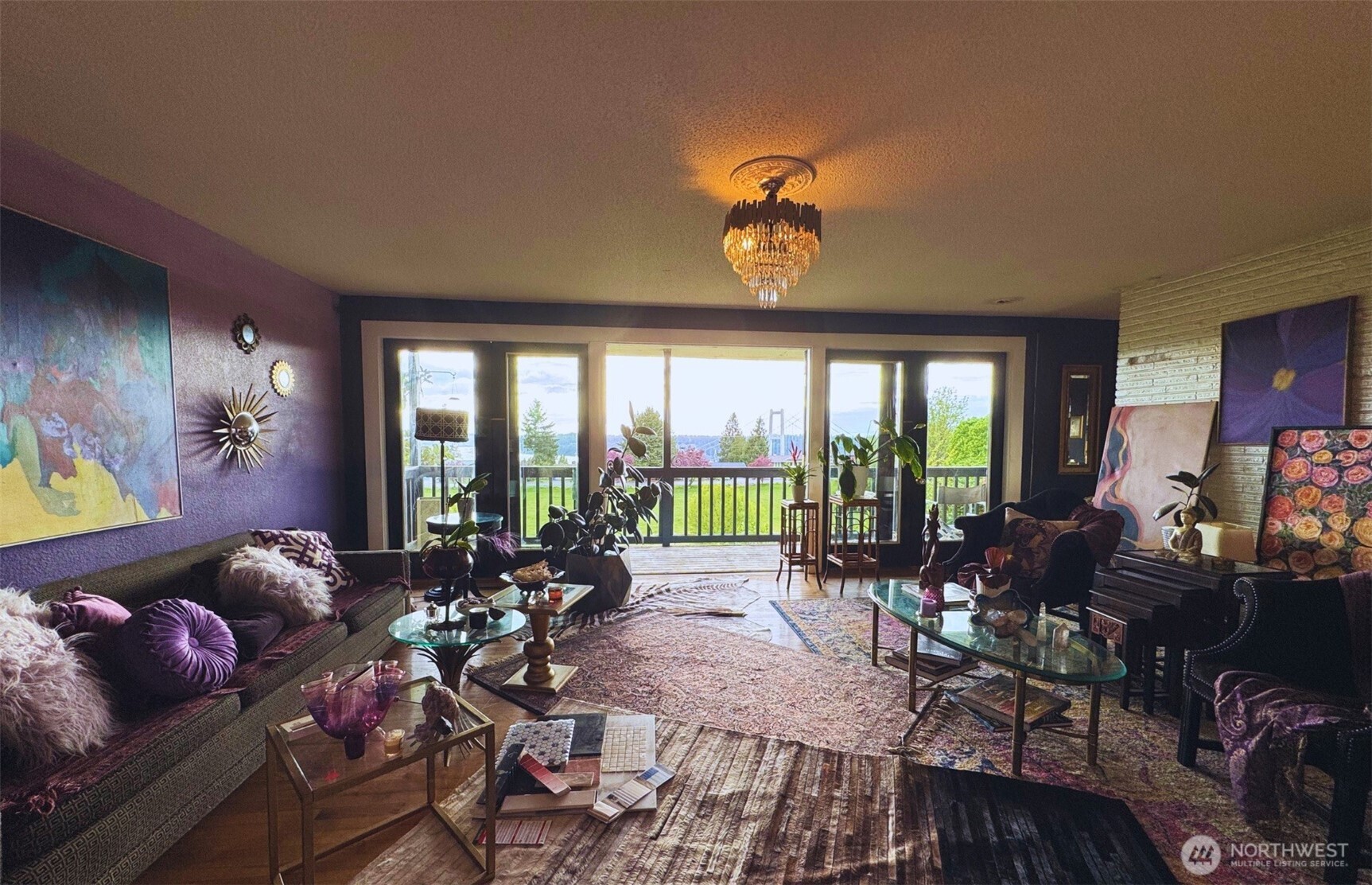 Big living room with wall of French doors and view