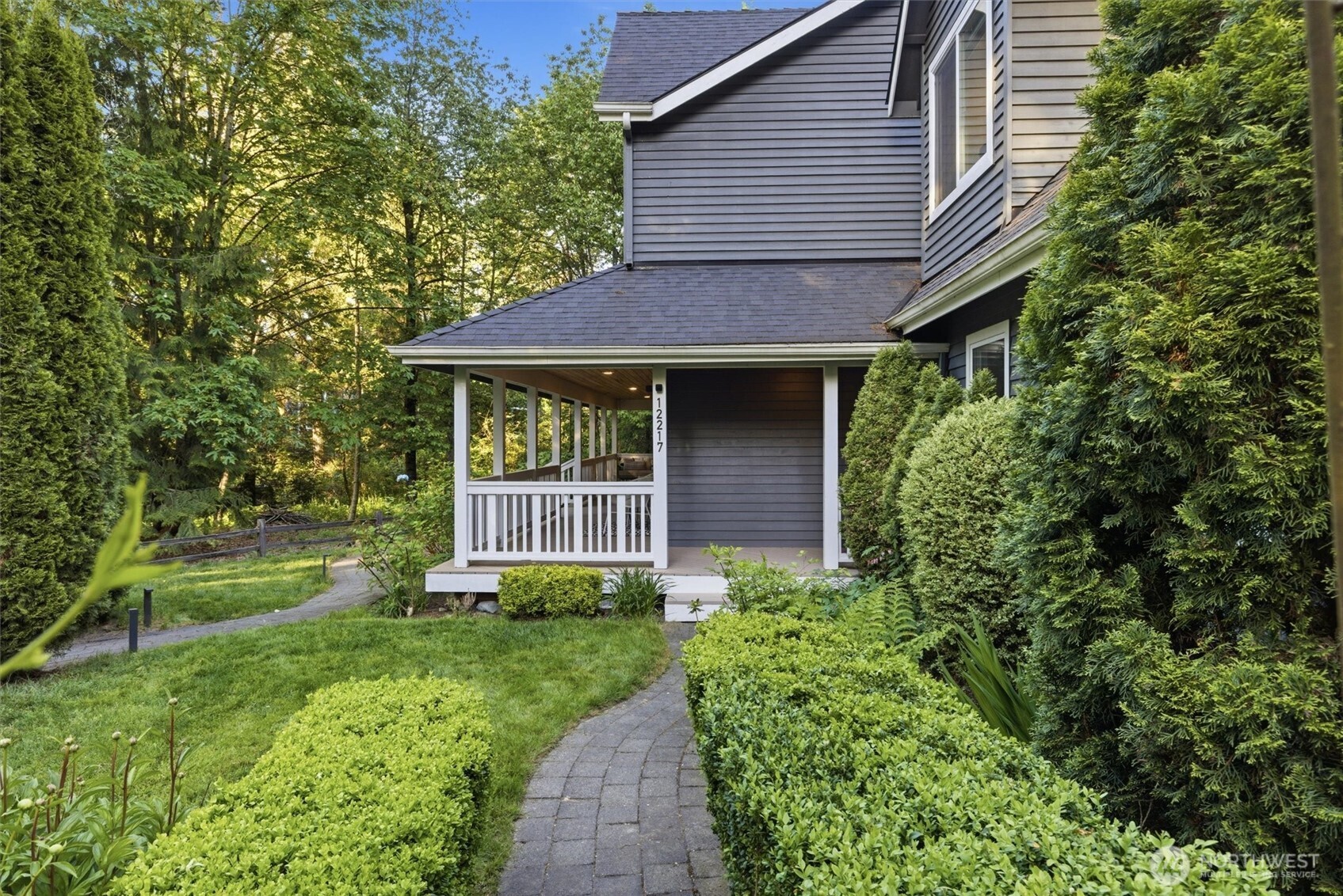 Wraparound porch designed to take in tranquil nature views year-round