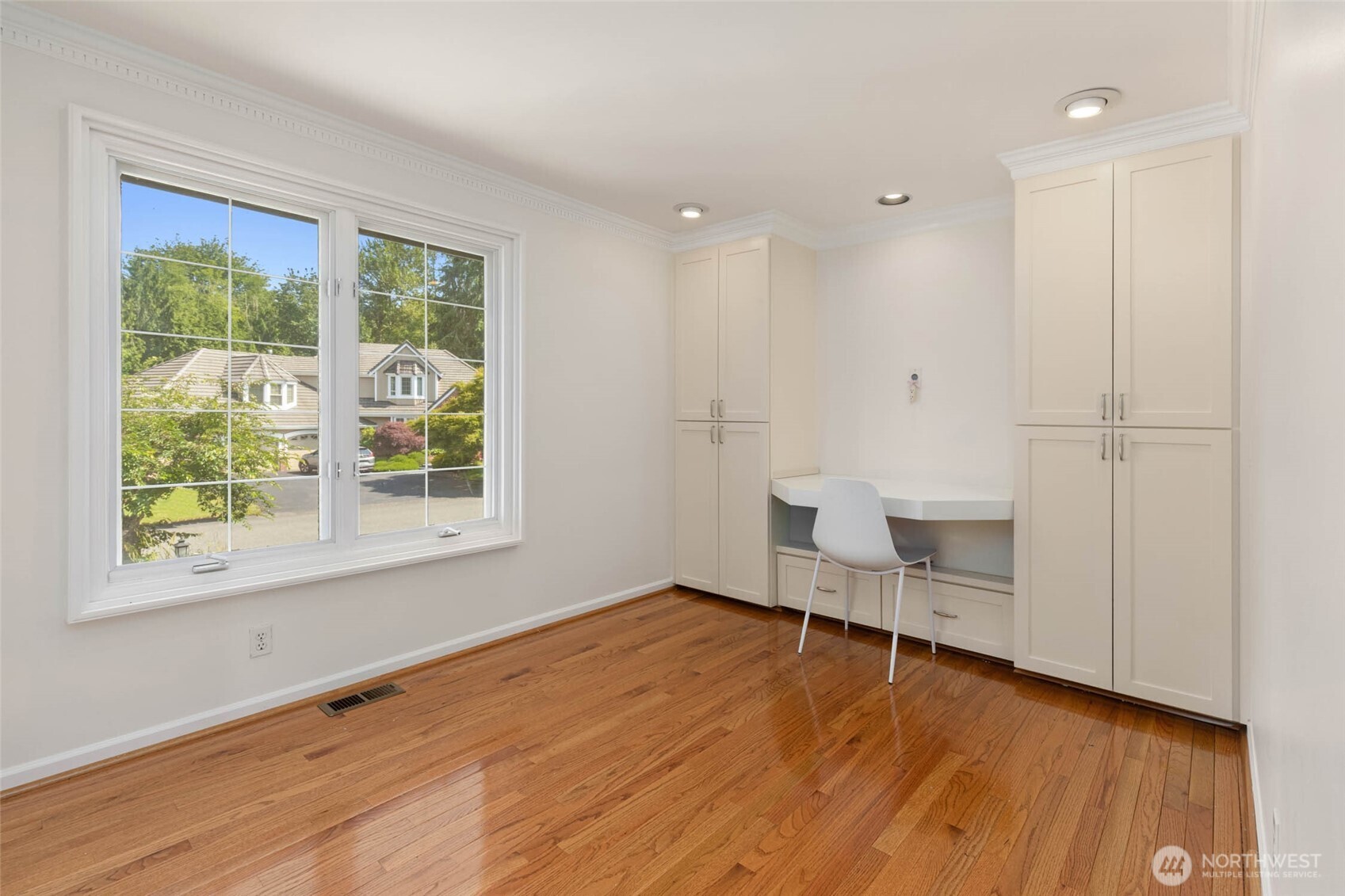 Bedroom #1 on upper level with murphy bed on the opposite wall. Makes a great bedroom or office!
