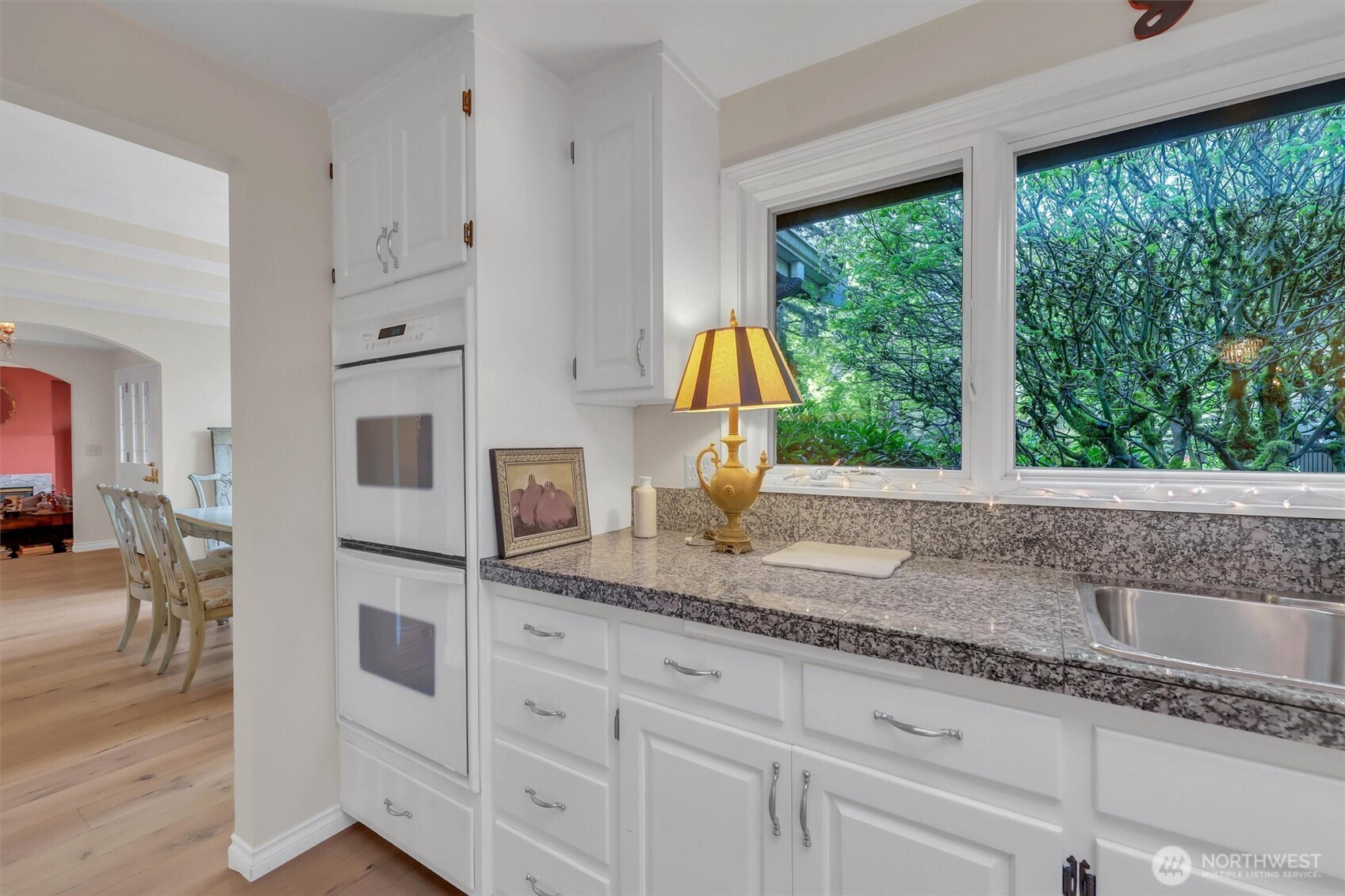 Double ovens and gas cooktop complete this chef's kitchen.