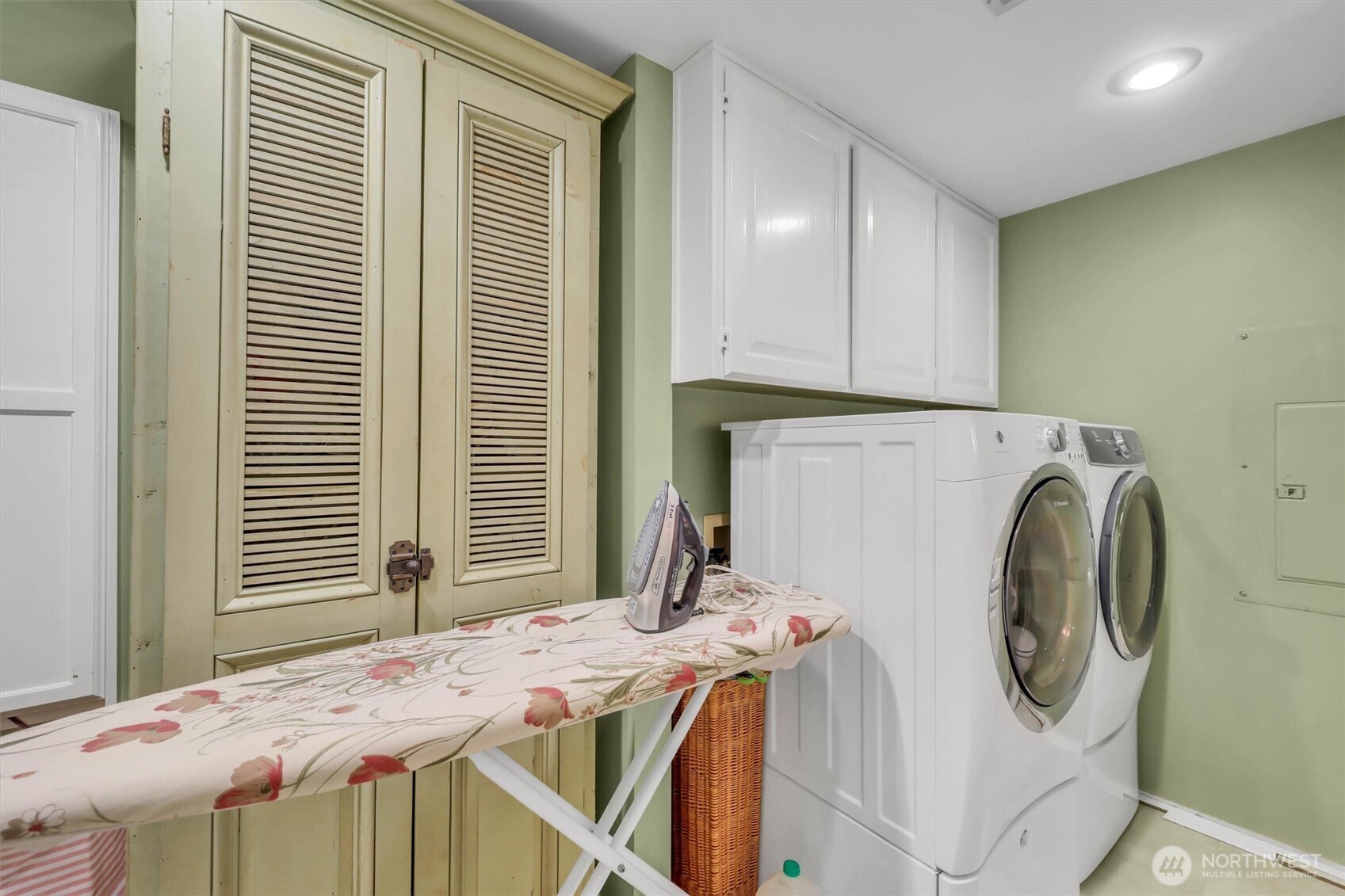 Large laundry room with toilet and sink and room to keep your ironing board out!