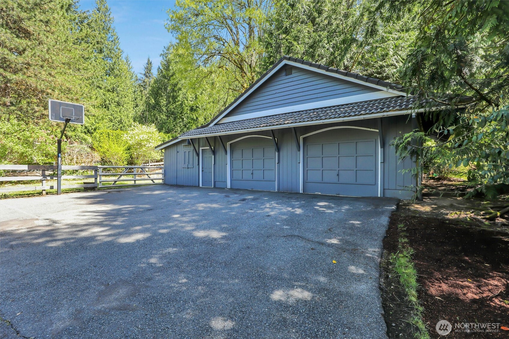30'X42' Shop/Barn with 2 garage doors, built-in workbench with cabinets and drawers for all of your tools, separate tack room/office
