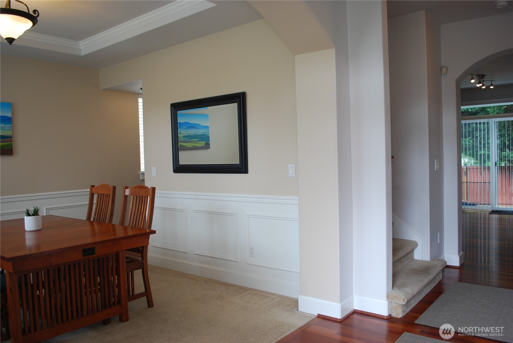 Enter to real Brazilian cherry hardwood floors, 9 foot ceilings, and craftsman millwork.  Dining room to the left and den to the right.