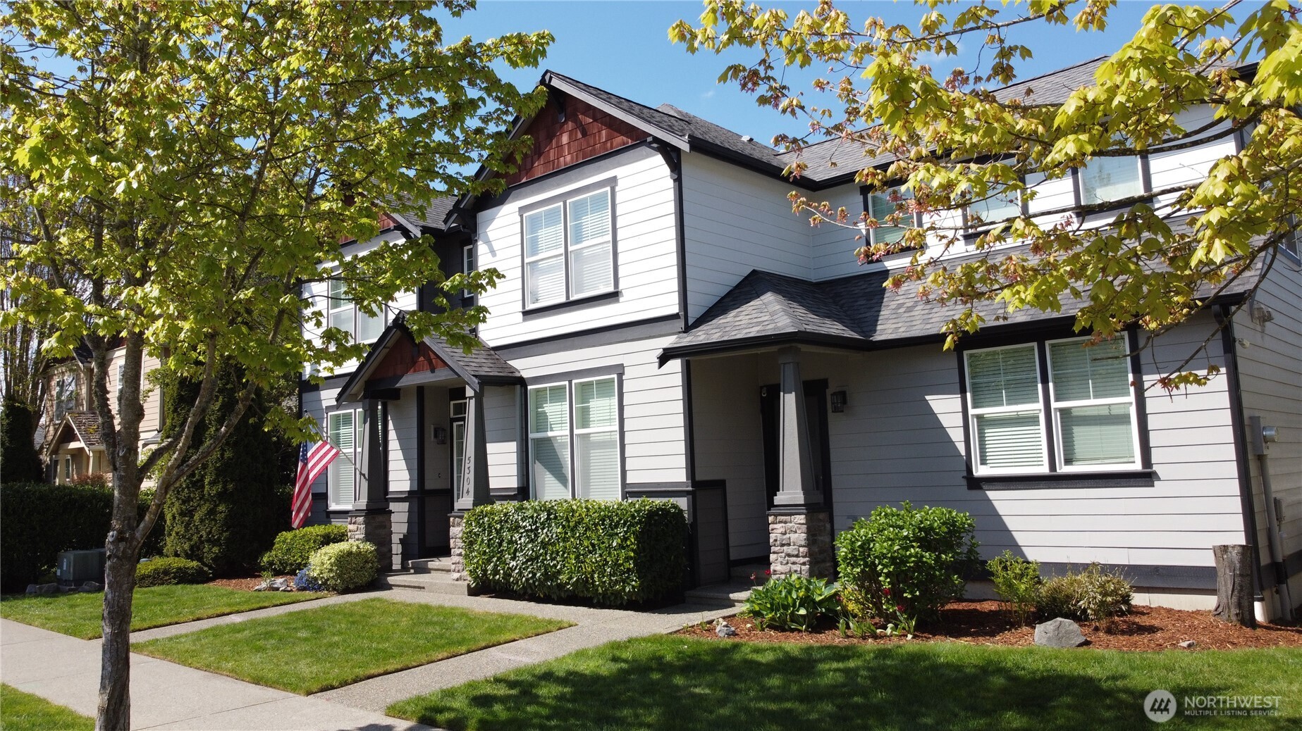 Impressive exterior with mature landscaping, washed aggregate walkways, designer paint, covered front entry, and rear patio with cover.