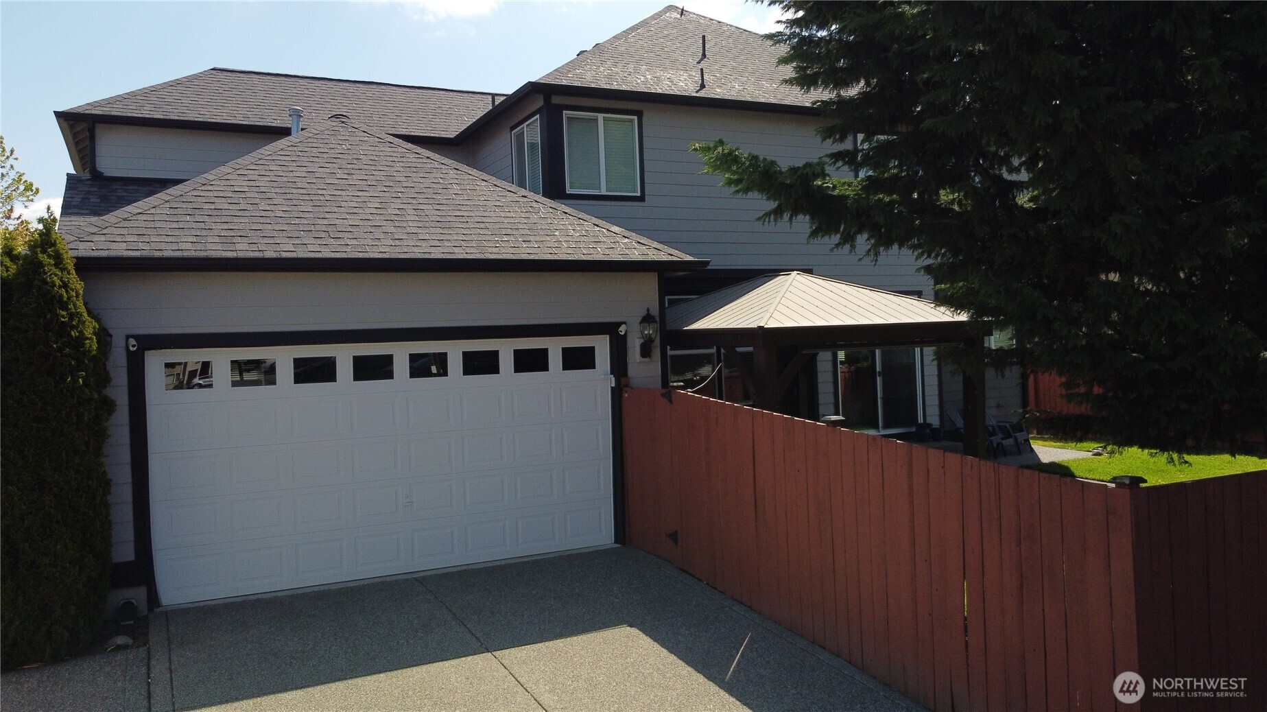 Alley access to 3 car tandem garage with 3 car width driveway and fully fence backyard.