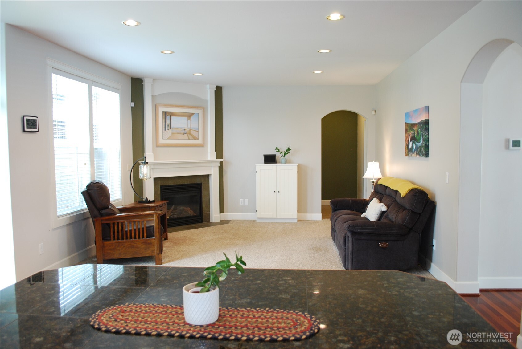 View from the kitchen across the island into the family room.