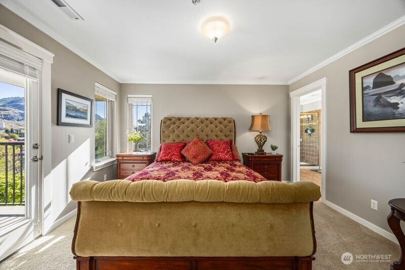 Primary bedroom with TV on opposite wall