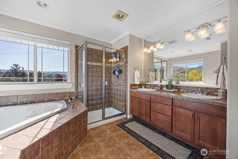 Large Primay full bathroom with shower and soaking tub, double vanities
