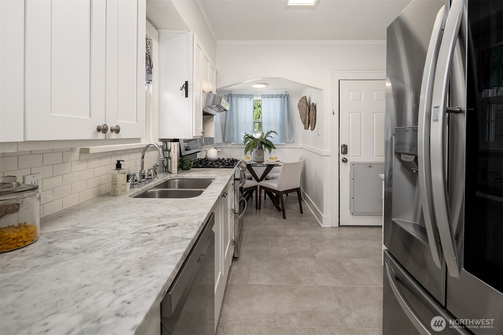 Cute Updated Kitchen with Marble Countertops and a spot to have a 2nd dining space