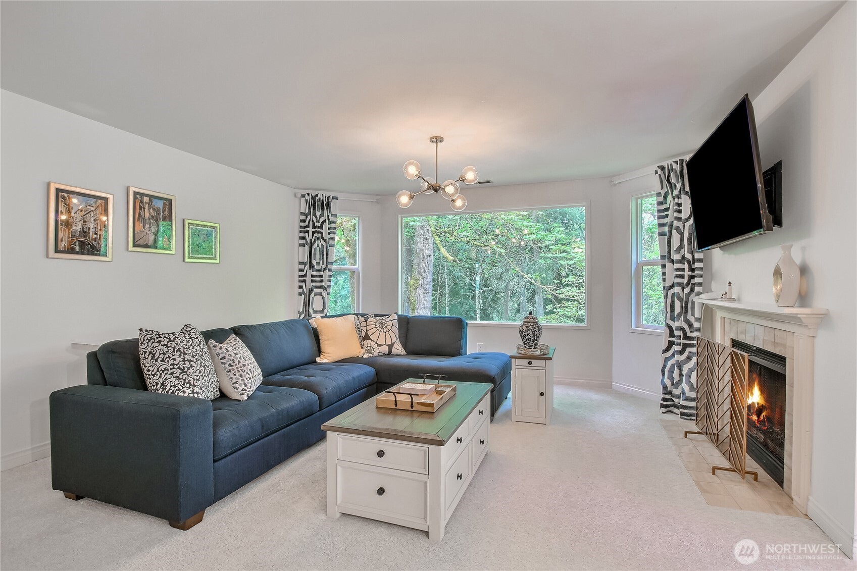 Living room with breathtaking views, newly painting interior, warm cozy wood burning fireplace.