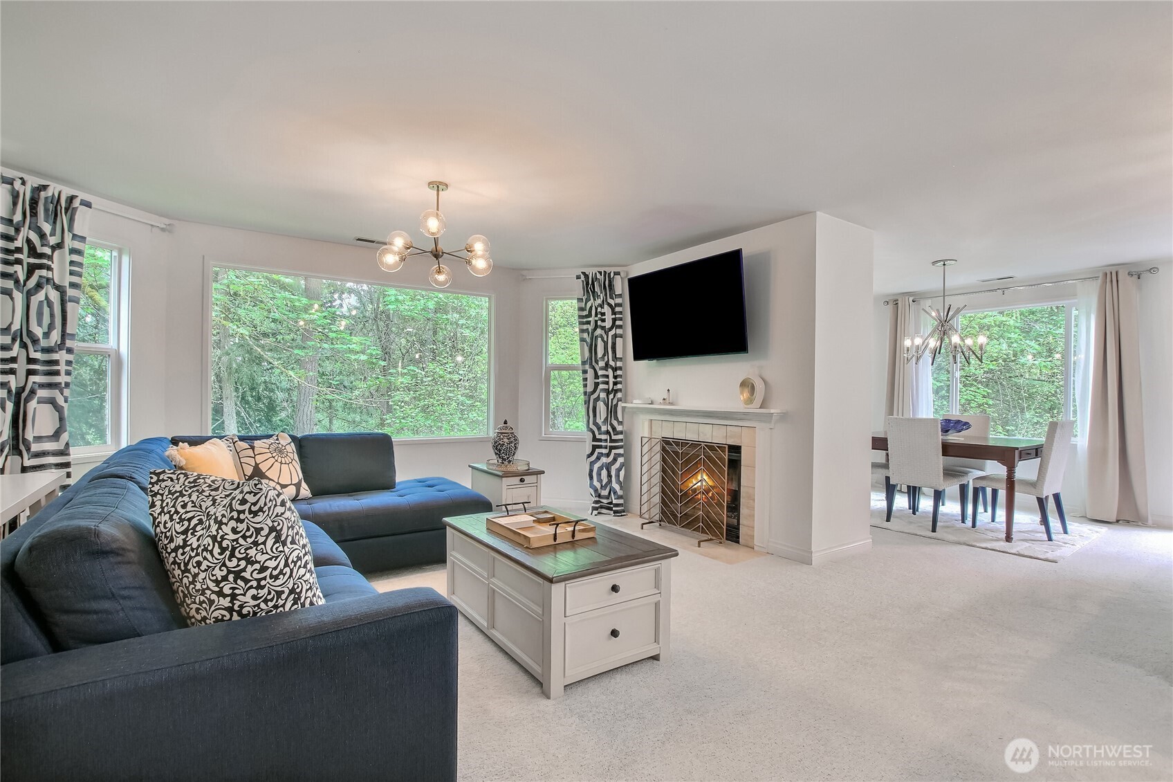 Living/dining areas are flooding with light and panoramic tree views. You cannot beat the privacy or views on all sides of this condo!
