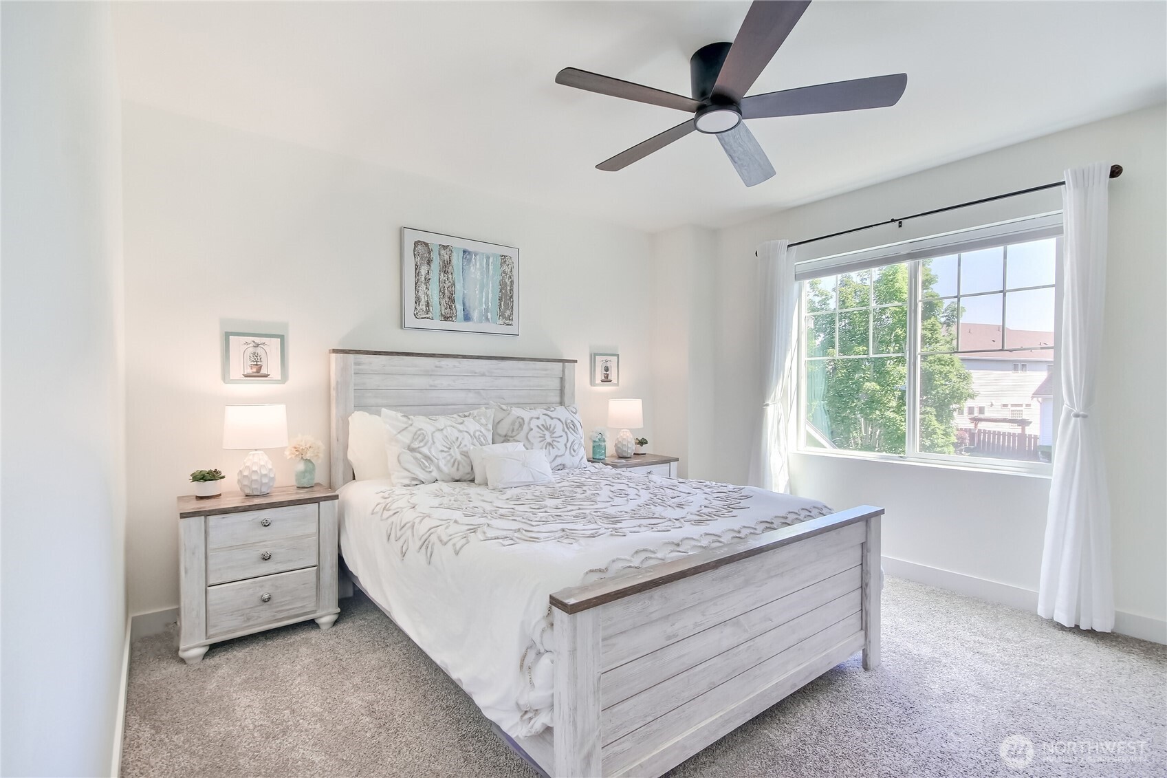 Spacious primary bedroom with newer carpet & plenty of room for all your furniture