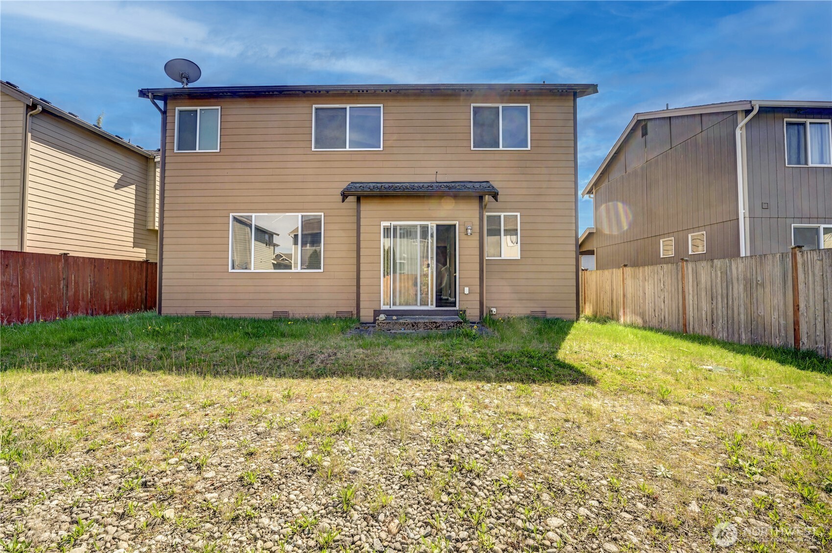 backyard - partially fenced with access to the alley way