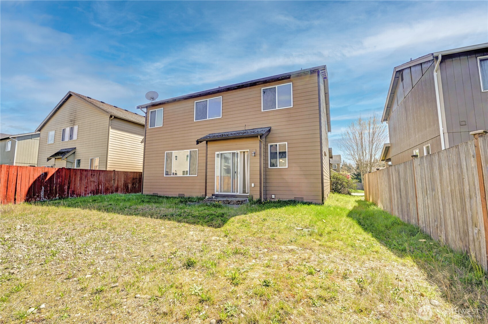 backyard - partially fenced with access to the alley way